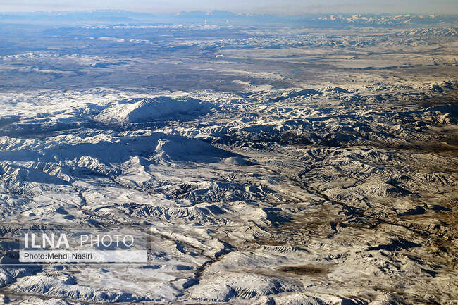 Aerial images of the snowy mountains on the border of Iran and Türkiye